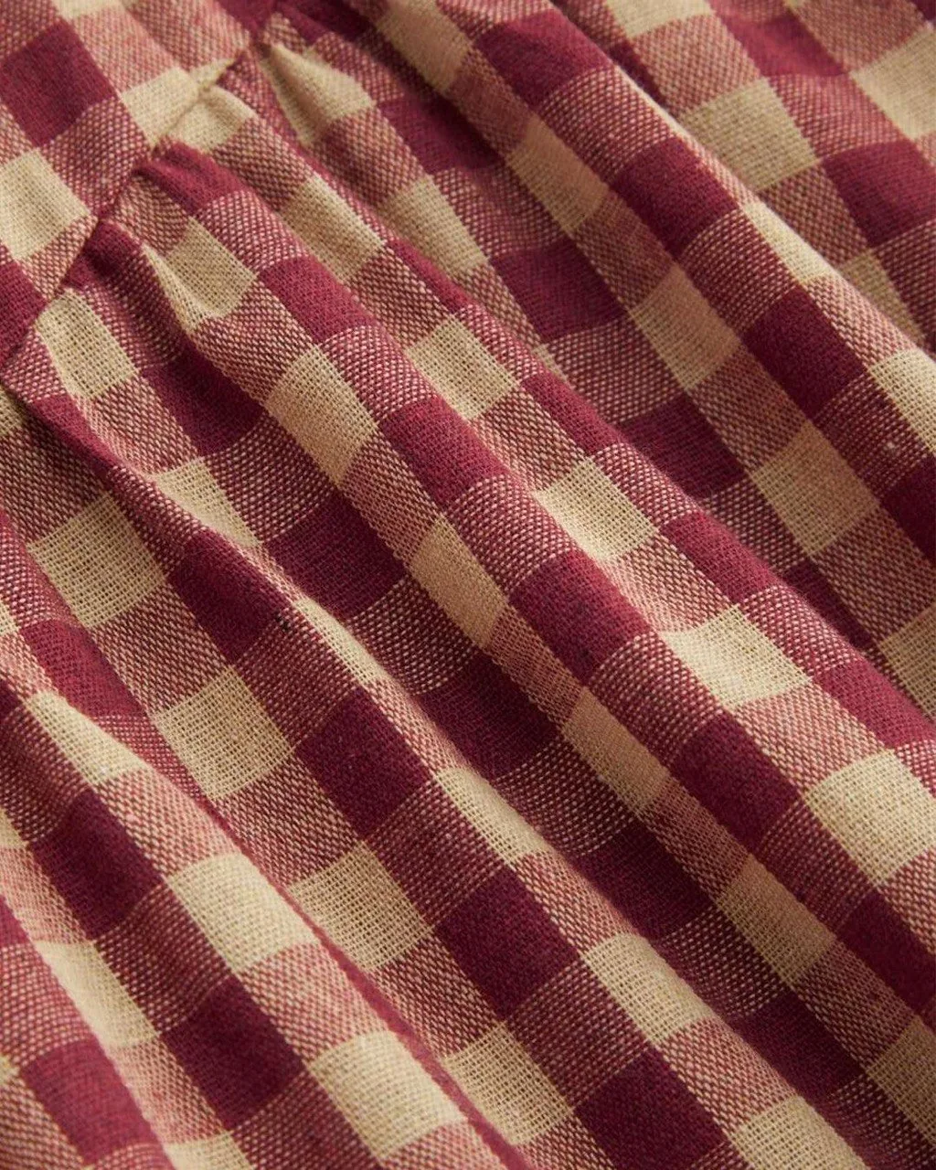 Burgundy gingham fabric detail