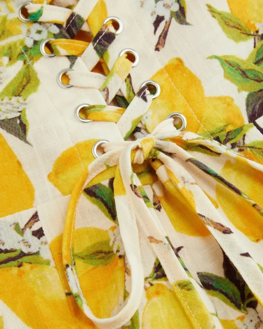 Lemon-print fabric with lace-up bodice detail